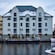 The lake view of Hotel Brosundet decorated with holiday lights in Ålesund, Norway